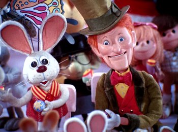 Movie still from “Here Comes Peter Cottontail” (1971), directed by Jules Bass – A man and a bunny rabbit on a table; Close Up shot, Low angle