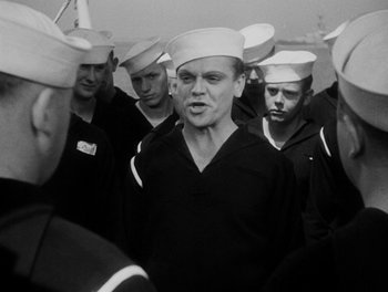 Movie still from “Here Comes the Navy” (1934), directed by Lloyd Bacon – Black and white photograph of a group of sailors; Medium shot, Low angle