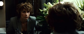 Movie still from “Hereafter” (2010), directed by Clint Eastwood – A woman sitting in front of a mirror looking at herself in the mirror; Close Up shot, Over the shoulder angle