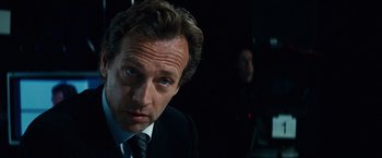 Movie still from “Hereafter” (2010), directed by Clint Eastwood – A person wearing a suit and tie; Close Up shot, Low angle