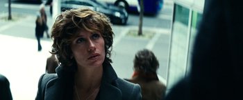 Movie still from “Hereafter” (2010), directed by Clint Eastwood – A person on a city street; Close Up shot, Over the shoulder angle