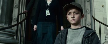 Movie still from “Hereafter” (2010), directed by Clint Eastwood – A young boy and a woman standing next to each other; Close Up shot, Low angle