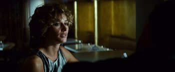 Movie still from “Hereafter” (2010), directed by Clint Eastwood – A woman sitting at a table in front of a mirror; Close Up shot, Over the shoulder angle