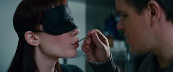 Movie still from “Hereafter” (2010), directed by Clint Eastwood – A man putting a needle in a woman's mouth; Extreme Close Up shot, Over the shoulder angle