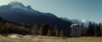 Movie still from “Hereafter” (2010), directed by Clint Eastwood – A house sitting in the middle of a field with mountains in the background; Extreme Wide shot, Low angle