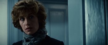 Movie still from “Hereafter” (2010), directed by Clint Eastwood – A woman in a black jacket and a white scarf; Close Up shot, Low angle