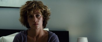 Movie still from “Hereafter” (2010), directed by Clint Eastwood – A person sitting in a room; Close Up shot, Over the shoulder angle