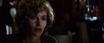 Movie still from “Hereafter” (2010), directed by Clint Eastwood – A person wearing a sweater; Close Up shot, Over the shoulder angle