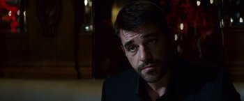 Movie still from “Hereafter” (2010), directed by Clint Eastwood – A person wearing a black shirt; Close Up shot, Over the shoulder angle