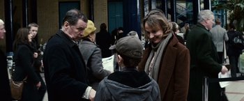 Movie still from “Hereafter” (2010), directed by Clint Eastwood – A man and a woman talking to a young boy; Medium shot, Over the shoulder angle