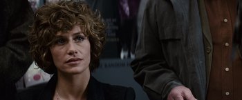 Movie still from “Hereafter” (2010), directed by Clint Eastwood – A person with curly brown hair; Close Up shot, Over the shoulder angle