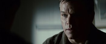 Movie still from “Hereafter” (2010), directed by Clint Eastwood – A man's face in a dark room; Close Up shot, Over the shoulder angle