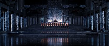 Movie still from “Hero” (2002), directed by Yimou Zhang – A group of people sitting in front of candles on a stage; Extreme Wide shot, High angle