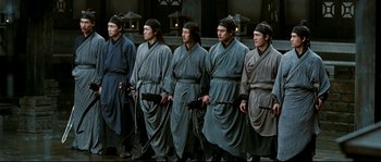 Movie still from “Hero” (2002), directed by Yimou Zhang – A group of men standing next to each other; Medium shot, High angle