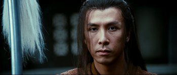 Movie still from “Hero” (2002), directed by Yimou Zhang – A person with long black hair; Close Up shot, Low angle