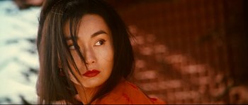 Movie still from “Hero” (2002), directed by Yimou Zhang – A person wearing a red shirt; Close Up shot, Low angle