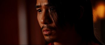 Movie still from “Hero” (2002), directed by Yimou Zhang – A person with long black hair; Close Up shot, Low angle