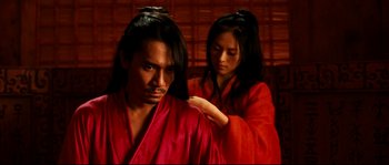 Movie still from “Hero” (2002), directed by Yimou Zhang – A man and a woman are combing each other's hair; Medium shot, Over the shoulder angle