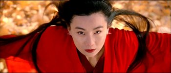 Movie still from “Hero” (2002), directed by Yimou Zhang – A person wearing a red shirt; Close Up shot, Low angle