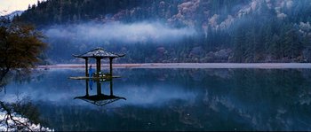 Movie still from “Hero” (2002), directed by Yimou Zhang – A gazebo sits in the middle of a body of water; Extreme Wide shot, High angle