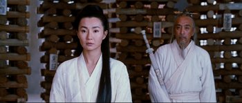 Movie still from “Hero” (2002), directed by Yimou Zhang – A woman with long black hair wearing a white robe; Medium shot, Over the shoulder angle