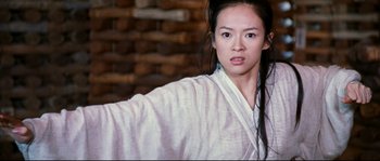 Movie still from “Hero” (2002), directed by Yimou Zhang – A woman in a white robe is posing for a picture; Close Up shot, Low angle