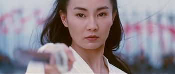 Movie still from “Hero” (2002), directed by Yimou Zhang – A person holding a glass of water; Close Up shot, Low angle