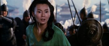 Movie still from “Hero” (2002), directed by Yimou Zhang – A person with long hair wearing a green shirt; Close Up shot, Over the shoulder angle
