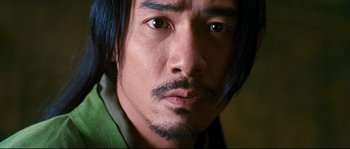 Movie still from “Hero” (2002), directed by Yimou Zhang – A person with long black hair; Close Up shot, Low angle