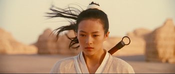 Movie still from “Hero” (2002), directed by Yimou Zhang – A woman with a sword in her hair; Close Up shot, Over the shoulder angle