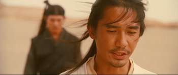 Movie still from “Hero” (2002), directed by Yimou Zhang – A person with long hair; Close Up shot, Over the shoulder angle