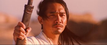 Movie still from “Hero” (2002), directed by Yimou Zhang – A person holding a sword; Close Up shot, Low angle