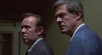 Movie still from “Hickey & Boggs” (1972), directed by Robert Culp – A couple of men standing next to each other; Close Up shot, Low angle