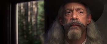 Movie still from “Hidalgo” (2004), directed by Joe Johnston – An old man with long grey hair and a white beard; Close Up shot, Low angle