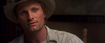 Movie still from “Hidalgo” (2004), directed by Joe Johnston – A person wearing a cowboy hat; Close Up shot, Over the shoulder angle