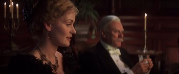 Movie still from “Hidalgo” (2004), directed by Joe Johnston – An older man and a younger woman sitting next to each other; Close Up shot, Over the shoulder angle