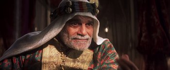 An old man with a beard wearing a turban
