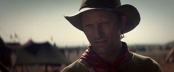 Movie still from “Hidalgo” (2004), directed by Joe Johnston – A man wearing a cowboy hat and a bandana; Close Up shot, Low angle