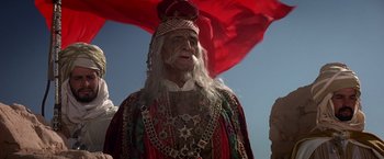 Movie still from “Hidalgo” (2004), directed by Joe Johnston – An old man dressed in a costume with a long white beard; Medium shot, Low angle
