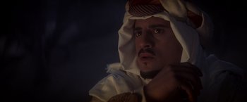 Movie still from “Hidalgo” (2004), directed by Joe Johnston – A person wearing a headdress; Close Up shot, Over the shoulder angle