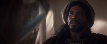 Movie still from “Hidalgo” (2004), directed by Joe Johnston – A person with a beard wearing a turban; Close Up shot, Over the shoulder angle
