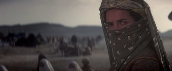 Movie still from “Hidalgo” (2004), directed by Joe Johnston – A man with a bandanna covering his face in the desert; Close Up shot, Over the shoulder angle