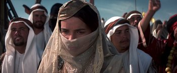 Movie still from “Hidalgo” (2004), directed by Joe Johnston – A woman with a veil covering her face and a man with a beard; Close Up shot, Over the shoulder angle