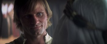 Movie still from “Hidalgo” (2004), directed by Joe Johnston – A person wearing a white shirt; Close Up shot, Over the shoulder angle