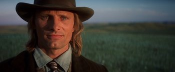 Movie still from “Hidalgo” (2004), directed by Joe Johnston – A person wearing a hat and a suit; Close Up shot, Low angle