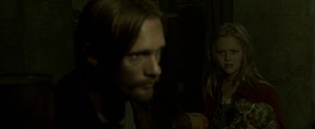 Movie still from “Hidden” (2015), directed by Ross Duffer – A man and a woman in a dark room; Close Up shot, Over the shoulder angle