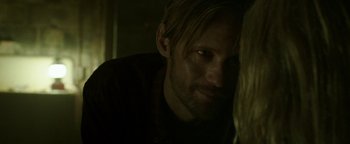 Movie still from “Hidden” (2015), directed by Ross Duffer – A person looking at the camera; Close Up shot, Over the shoulder angle