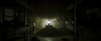 Movie still from “Hidden” (2015), directed by Ross Duffer – A light in a room with bunk beds; Extreme Wide shot, Overhead angle