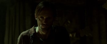 Movie still from “Hidden” (2015), directed by Ross Duffer – A person wearing a jacket; Close Up shot, Over the shoulder angle