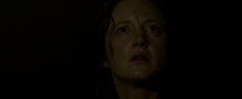 Movie still from “Hidden” (2015), directed by Ross Duffer – A person looking up at the sky; Close Up shot, Low angle